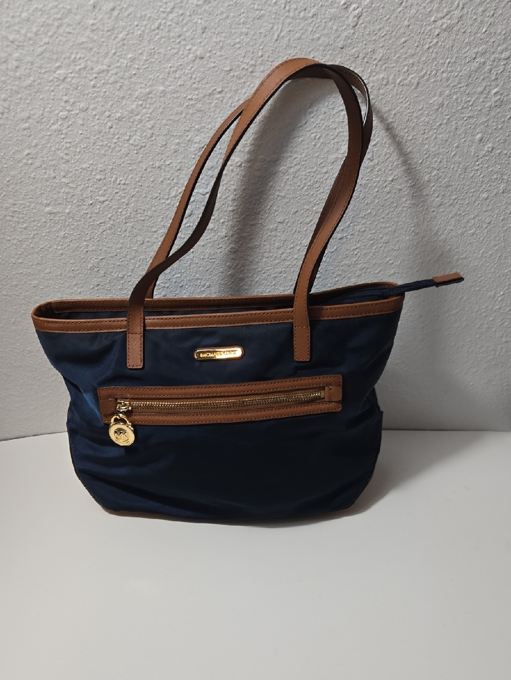 Michael Kors Navy Tote with Brown Trim and Gold Accents